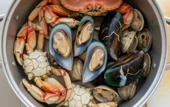Seattle seafood lover inspecting fresh shellfish before steaming